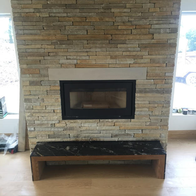 Cutting edge stove with cut stone